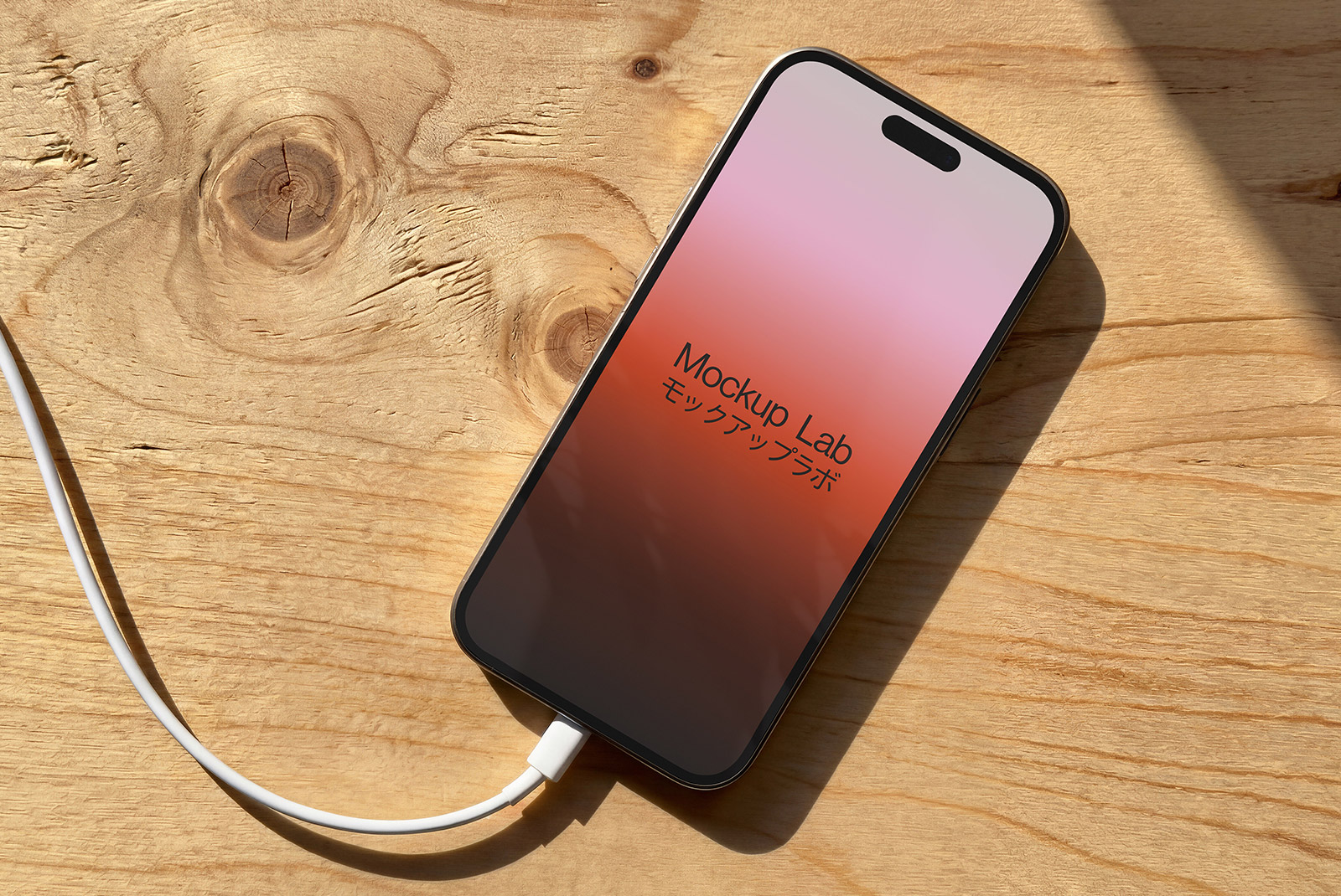 Overhead view of an iPhone 12ML mockup displaying a vibrant app interface on a clean background.